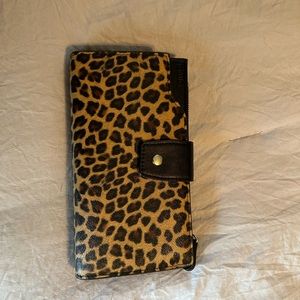 Vegan leather cheetah print and black wallet.